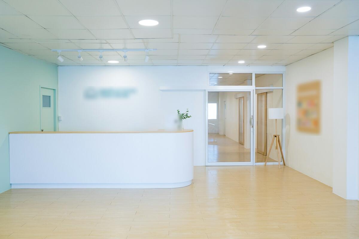 The front desk and waiting area of a bright, quiet dental office